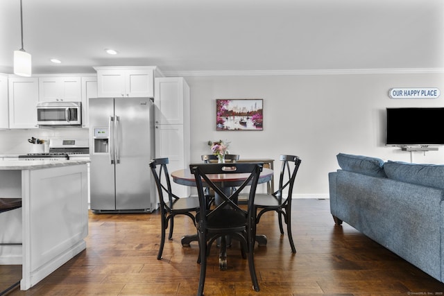 92 Lafayette St Apt 5, Stamford, CT 06902 - dining space with crown molding, recessed lighting, and dark wood-style floors