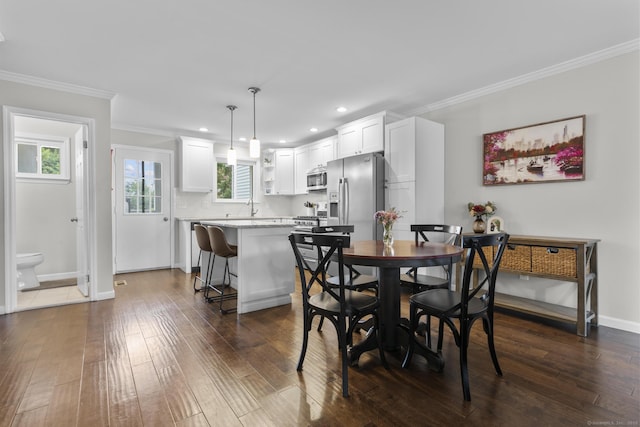 92 Lafayette St Apt 5, Stamford, CT 06902 - dining space with dark wood-style floors, recessed lighting, and crown molding