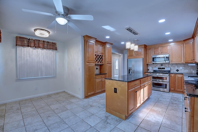673 May St, Naugatuck, CT 06770 - kitchen featuring stainless steel appliances, decorative backsplash, ceiling fan, light tile patterned flooring, and a center island