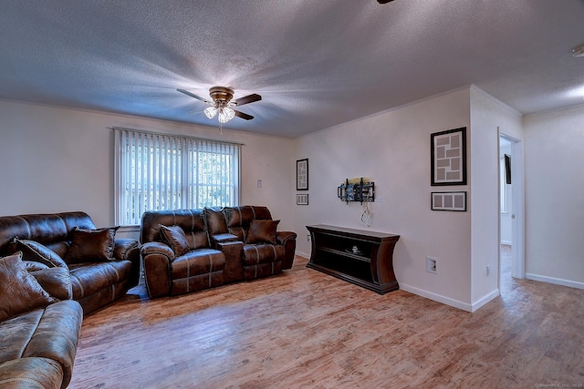 673 May St, Naugatuck, CT 06770 - living room with a ceiling fan, wood finished floors, and a textured ceiling