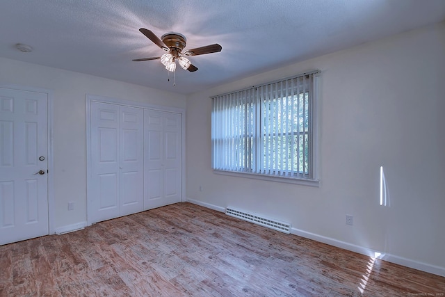 673 May St, Naugatuck, CT 06770 - unfurnished bedroom featuring wood finished floors, a closet, and a ceiling fan