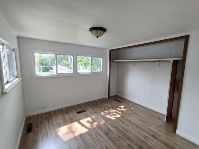 29 Hemlock Dr, Shelton, CT 06484 - unfurnished bedroom with wood finished floors, baseboards, and a closet