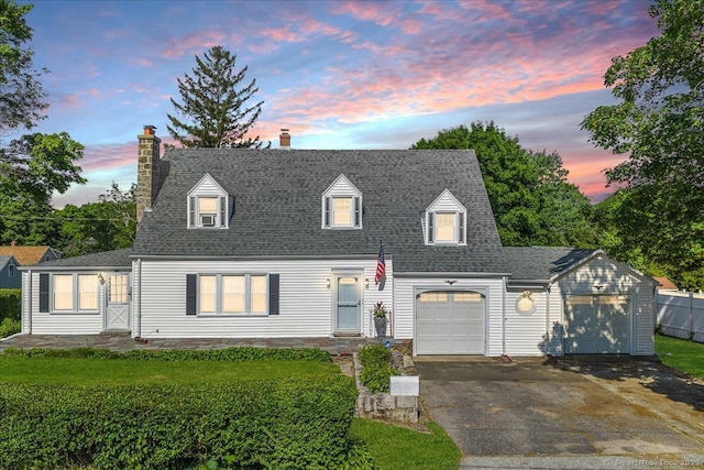 17 Wild Rose Pl, Waterford, CT 06385 - cape cod home with a chimney, driveway, an attached garage, and a shingled roof
