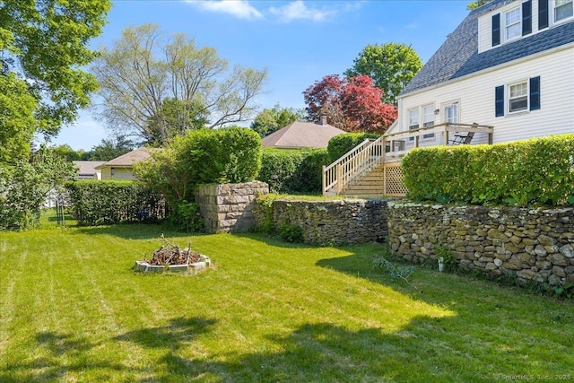 17 Wild Rose Pl, Waterford, CT 06385 - view of grassy yard with stairway and an outdoor fire pit
