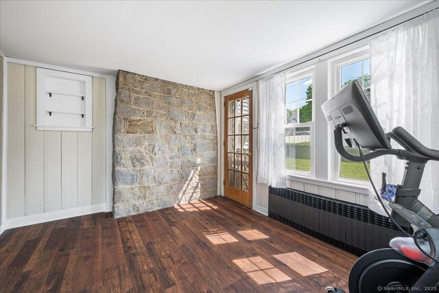 17 Wild Rose Pl, Waterford, CT 06385 - workout room featuring radiator heating unit, wood finished floors, baseboards, and built in features