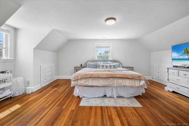 17 Wild Rose Pl, Waterford, CT 06385 - bedroom featuring wood finished floors, lofted ceiling, and baseboards