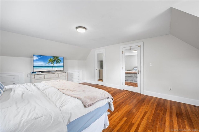 17 Wild Rose Pl, Waterford, CT 06385 - bedroom with lofted ceiling, wood finished floors, and baseboards