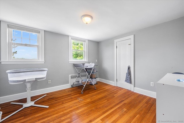 17 Wild Rose Pl, Waterford, CT 06385 - miscellaneous room featuring radiator, light wood-style flooring, and baseboards