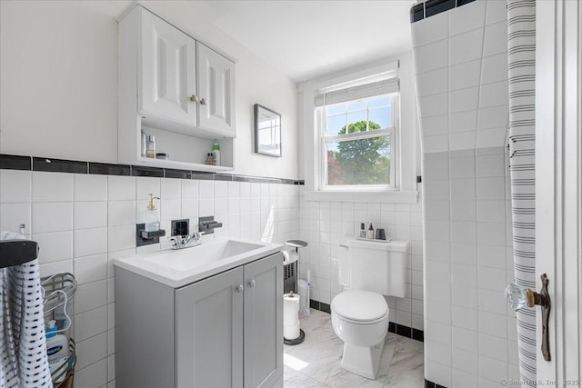 17 Wild Rose Pl, Waterford, CT 06385 - bathroom with tile walls, toilet, vanity, marble finish floors, and a bidet