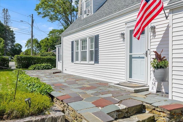 17 Wild Rose Pl, Waterford, CT 06385 - property entrance featuring roof with shingles and a patio area