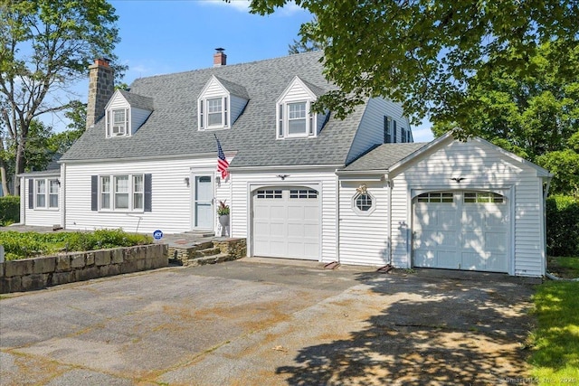17 Wild Rose Pl, Waterford, CT 06385 - cape cod-style house with a chimney, driveway, roof with shingles, and an attached garage