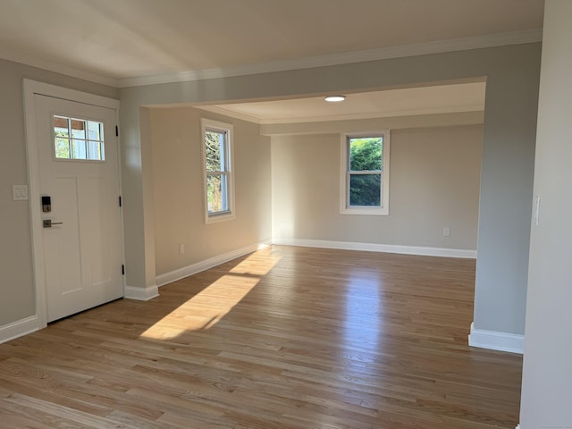 42 Waldo St, East Haven, CT 06512 - foyer entrance with wood finished floors, baseboards, and crown molding