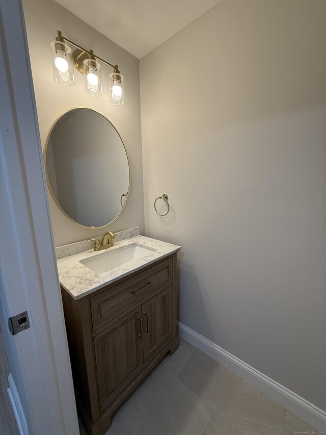 42 Waldo St, East Haven, CT 06512 - bathroom with vanity, tile patterned flooring, and baseboards