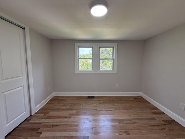 42 Waldo St, East Haven, CT 06512 - unfurnished room with wood finished floors and baseboards