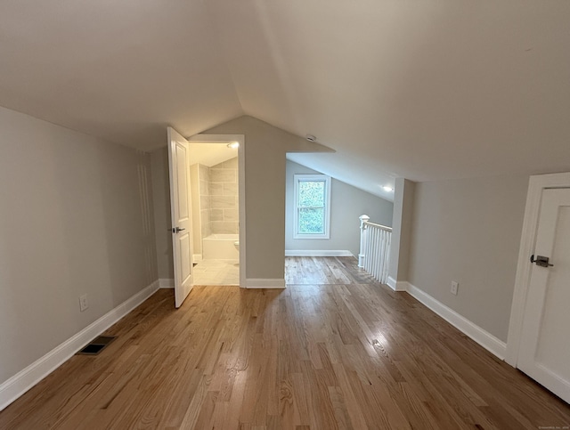 42 Waldo St, East Haven, CT 06512 - additional living space with wood finished floors, lofted ceiling, and baseboards