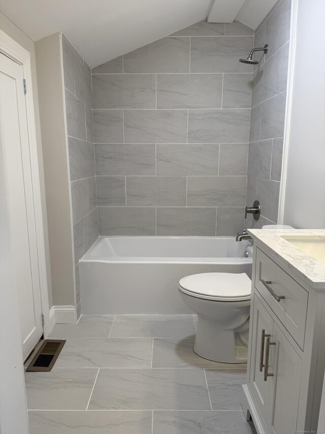 42 Waldo St, East Haven, CT 06512 - full bath with toilet, vanity, shower / bathtub combination, marble finish flooring, and vaulted ceiling