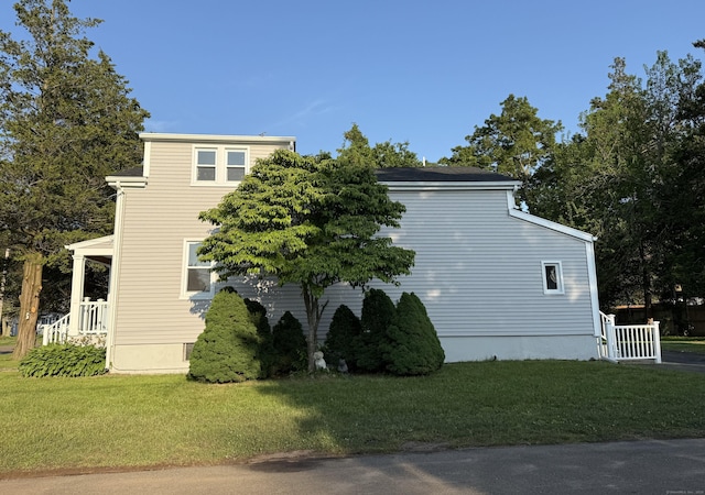 42 Waldo St, East Haven, CT 06512 - view of side of property with a lawn