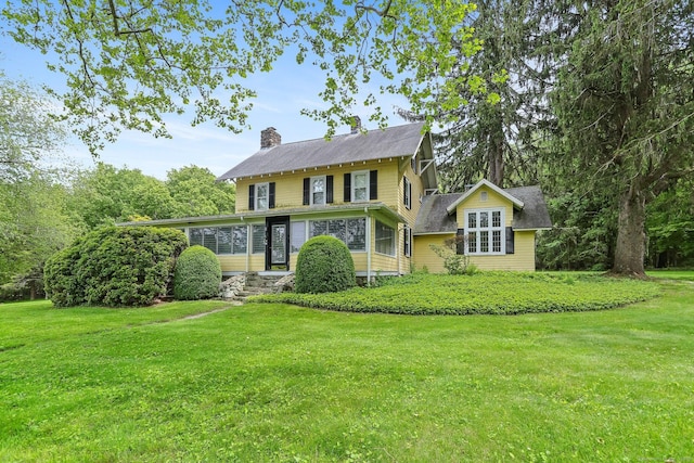 12 Lords Hwy E, Weston, CT 06883 - view of front of house with a chimney and a front yard