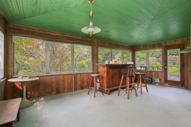 12 Lords Hwy E, Weston, CT 06883 - sunroom with wood walls, carpet flooring, and lofted ceiling