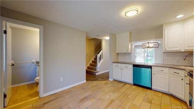 12 Cardinal Dr Unit 12, Farmington, CT 06032 - kitchen featuring dishwasher, a sink, backsplash, and light wood-type flooring