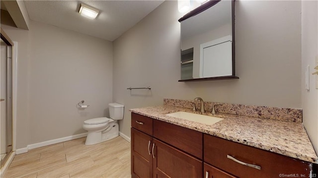 12 Cardinal Dr Unit 12, Farmington, CT 06032 - bathroom with vanity, toilet, and baseboards
