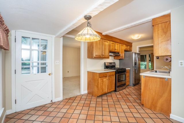 35 Chestnut Hill Rd, Simsbury, CT 06092 - kitchen with stainless steel appliances, under cabinet range hood, light countertops, light tile patterned flooring, and decorative light fixtures
