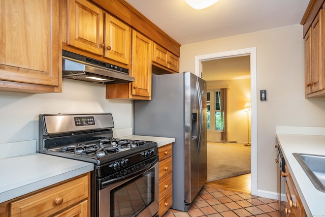 35 Chestnut Hill Rd, Simsbury, CT 06092 - kitchen featuring appliances with stainless steel finishes, under cabinet range hood, light countertops, light tile patterned flooring, and brown cabinetry