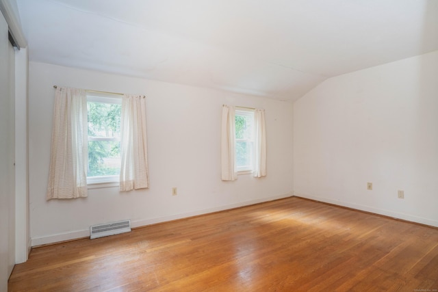 35 Chestnut Hill Rd, Simsbury, CT 06092 - unfurnished room with light wood-type flooring, plenty of natural light, and vaulted ceiling