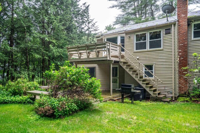 35 Chestnut Hill Rd, Simsbury, CT 06092 - back of house with stairs, a lawn, and a deck