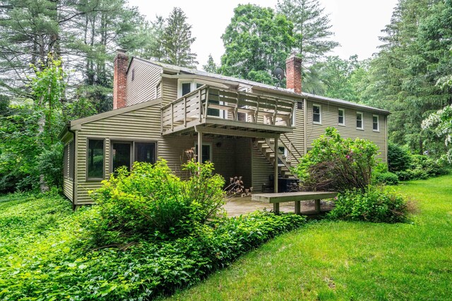 35 Chestnut Hill Rd, Simsbury, CT 06092 - back of house featuring a chimney, a deck, and stairway