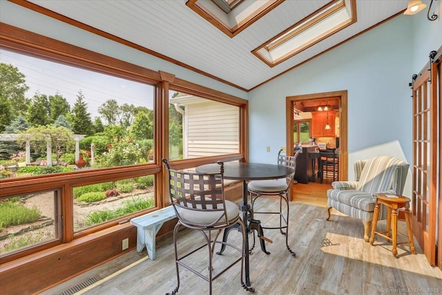 45 Snell Rd, Middlefield, CT 06422 - sunroom / solarium featuring lofted ceiling, a skylight, plenty of natural light, and a barn door