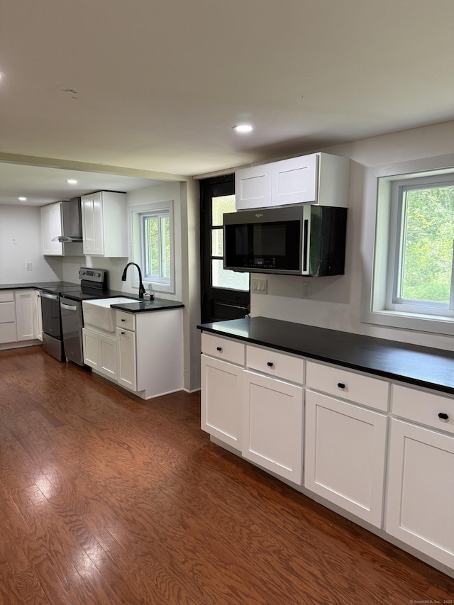 116 Howd Rd, Durham, CT 06422 - kitchen with stainless steel appliances, wall chimney exhaust hood, white cabinetry, dark countertops, and recessed lighting
