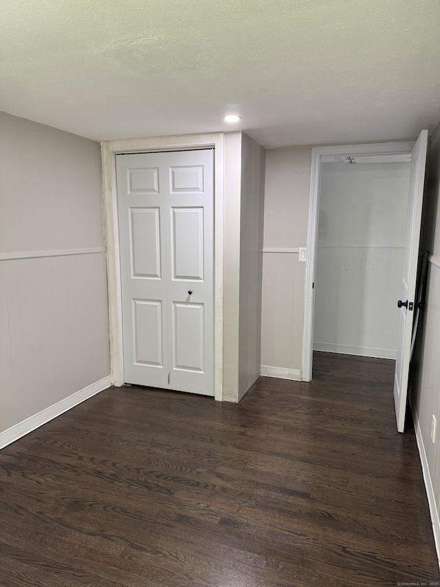 116 Howd Rd, Durham, CT 06422 - unfurnished bedroom featuring dark wood-style flooring, a closet, and wainscoting
