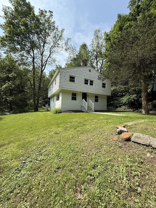 116 Howd Rd, Durham, CT 06422 - rear view of house featuring a yard and concrete block siding