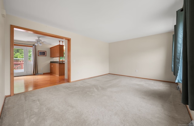 42 Cindy Ln, Groton, CT 06355 - empty room with light colored carpet and a ceiling fan