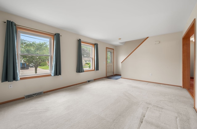 42 Cindy Ln, Groton, CT 06355 - unfurnished room with healthy amount of natural light and light carpet