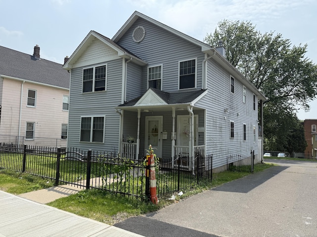 337 Zion St, Hartford, CT 06106 - view of front facade featuring covered porch and a fenced front yard