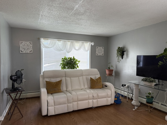 337 Zion St, Hartford, CT 06106 - living area with wood finished floors, a textured ceiling, and a baseboard heating unit