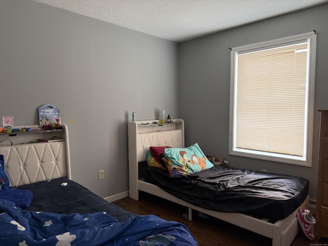 337 Zion St, Hartford, CT 06106 - bedroom featuring wood finished floors and a textured ceiling