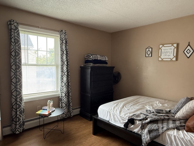 337 Zion St, Hartford, CT 06106 - bedroom featuring wood finished floors and a textured ceiling