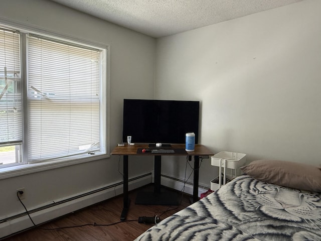 337 Zion St, Hartford, CT 06106 - bedroom with wood finished floors, a textured ceiling, and a baseboard radiator