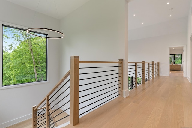 22 Limekiln Rd, Redding, CT 06896 - hallway with plenty of natural light, wood finished floors, baseboards, an upstairs landing, and recessed lighting