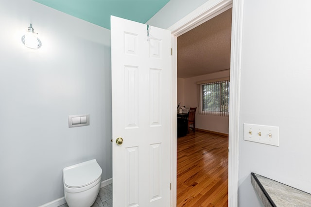 2 Mansfield Grove Rd Apt 160, East Haven, CT 06512 - bathroom with baseboards, toilet, and wood finished floors
