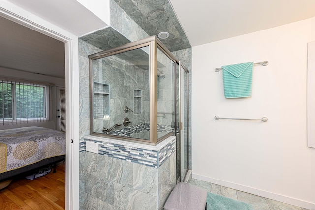 2 Mansfield Grove Rd Apt 160, East Haven, CT 06512 - ensuite bathroom with a stall shower and baseboards