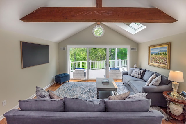 156 Main St, Ridgefield, CT 06877 - living room featuring a skylight, wood finished floors, and baseboards