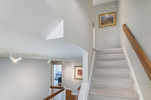 156 Main St, Ridgefield, CT 06877 - stairs featuring track lighting, wood finished floors, and baseboards