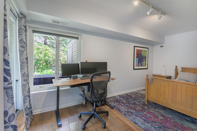 156 Main St, Ridgefield, CT 06877 - bedroom with track lighting, wood finished floors, a desk, and baseboards