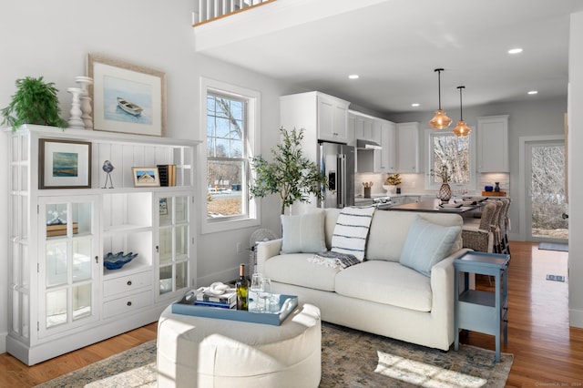7 Ivy Hill Rd, Waterford, CT 06385 - living area with light wood finished floors and recessed lighting