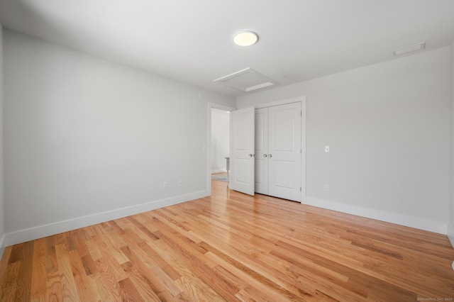 7 Ivy Hill Rd, Waterford, CT 06385 - unfurnished room featuring attic access, light wood finished floors, and baseboards