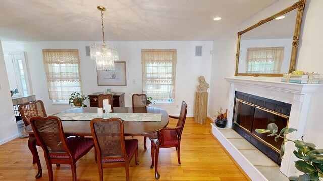 77 Bassett Rd, North Haven, CT 06473 - dining space featuring plenty of natural light, a chandelier, light wood-style floors, and recessed lighting